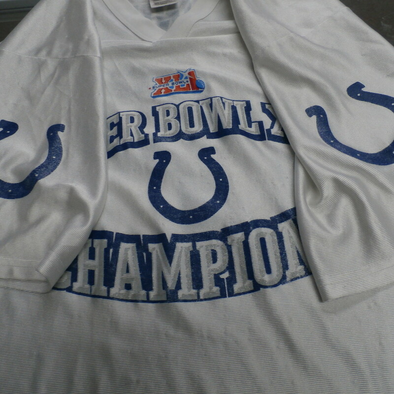 Indianapolis Colts Super Bowl XLI Peyton Manning #18 Champions Jersey #24644
Rating: (see below) 4 - Fair Condition
Team: Indianapolis Colts
Player: Peyton Manning #18
Brand: NFL
Size:  Medium Men's  - (Measured Flat: chest 21\", length 29\")
Measured laying flat: armpit to armpit; top of shoulder to bottom hem
Color: White
Style:Jersey; screen pressed logos;
Material: 100% polyester
Condition: 4 - Fair Condition: wrinkles; minor pilling or fuzz; lots of snags; light staining throughout; logos are faded out and worn looking; part of the 8 is worn off; stretched out from washing or use;
Item #: 24644
Shipping: FREE