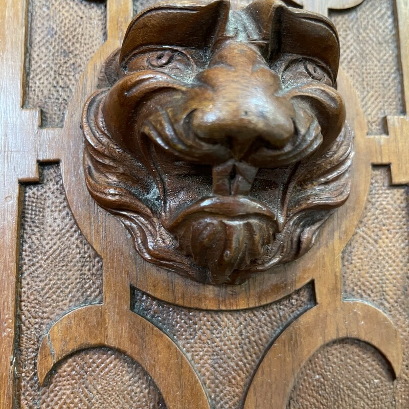 Beautifully detailed  Butlers cabinet; armoire. One large top drawer sits atop the cabinet doors; that open to a vast space with carved; notched spacers for shelving. Carved  Lion heads guard your treasures inside this solid piece.   38 1/2w x 18d x 53 1/2t.