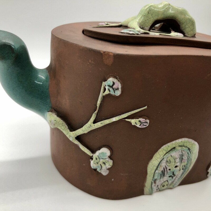 Antique Qing Dynasty Zisha Clay Signed Enameled Yixing Teapot 19th century. .<br />
Beautifully crafted and enameled with a flowering prunus tree. Marked on bottom. Minimal enamel loss and a few flea bites on the lid.<br />
Will ship priority mail