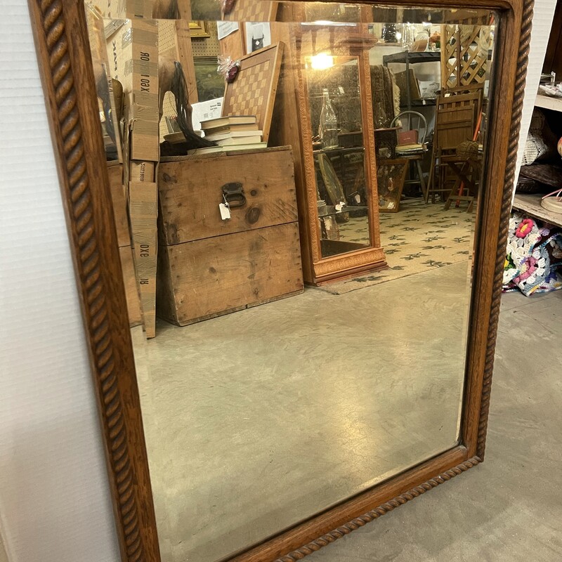 This large mirror; with a beautiful carved frame; measures at 27w x 33h. Ready to hang; perfect for a foyer or hallway; this looking glass is sure to reflect the perfect image. Come see for yourself!
