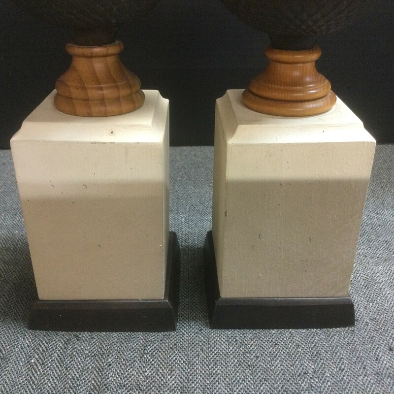 Carved acorn wood and brass finial sit a top their tall base. Propped on a shelf or mantle; this pair would stand out cradling a few of your favorite books. Lovely at 13 1/2h x 4w .