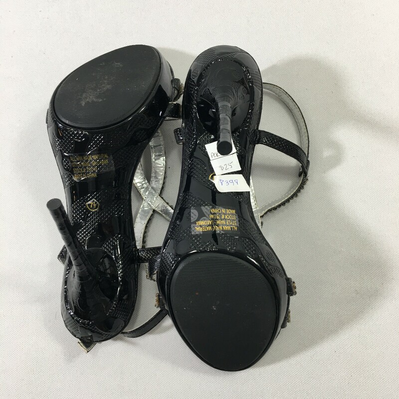 100-166 Wild Rose, Black, Size: 7.5
Black heels with sparkle lined straps