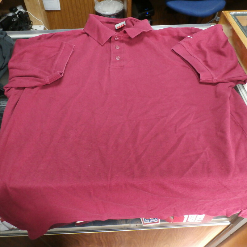 Nike Men's polo shirt maroon size Large Cotton Blend partial button #27865
Rating: (see below) 3- Good Condition
Team: n/a
Player: n/a
Brand: Nike
Size: Men's  Large- (Measured Flat: Across chest 23\"; Length 28\")
Measured Flat: underarm to underarm; top of shoulder to bottom hem
Color: Maroon
Style: polo shirt; partial button
Material: 73% Cotton 27% polyester
Condition: 3- Good Condition: wrinkled; minor pilling and fuzz; material is slightly faded and worn from washing and use; tiny hole on the back upper middle;
Item #: 27865
Shipping: FREE