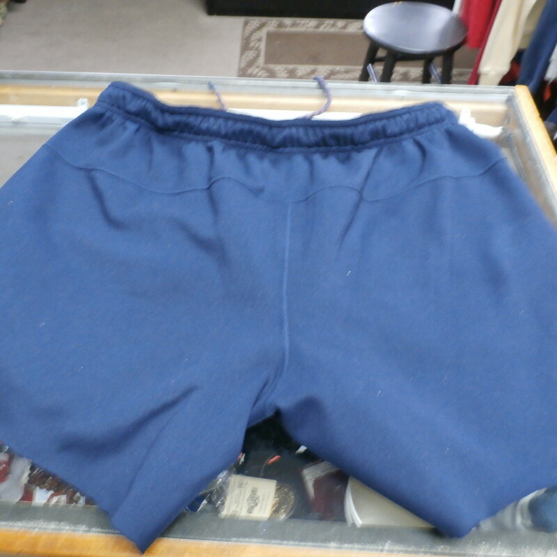 Nike Dri-Fit Men's Training pants cut to shorts Blue Size XL 27781<br />
Rating: (see below) 4- Fair Condition<br />
Team: N/A<br />
Player: N/A<br />
Brand: Nike Dri-Fit<br />
Size: Men's - X Large(Measured Flat: Waist 18\", length 15\" Inseam 6\")<br />
Color: Blue<br />
Style: training pants Cut to shorts<br />
Material: 95% Polyester 5% Spandex<br />
Condition: 4 - Fair Condition; Wrinkled; Minor pilling and fuzz; Cut to shorts; not cut completely even;<br />
Item #: 27781<br />
Shipping: FREE