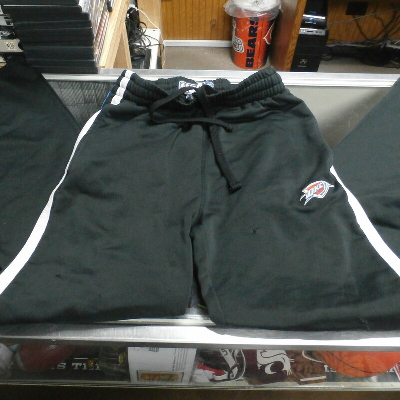 OKC Thunder Men's NBA Basketball Pants Black Size Small Polyester #28930<br />
Rating: (see below) 4- Fair Condition<br />
Team: OKC Thunder<br />
Player: Team<br />
Brand: NBA<br />
Size: Men's Small (Measured Flat: Waist 14\"; Length 44\"; inseam 31\")<br />
Measured flat: across waist laying flat; waist to bottom of legs; crotch to bottom of legs<br />
Color: Black<br />
Style: embroidered; leg zippers; drawstring and elastic waist; side pockets;<br />
Material:  100% Polyester<br />
Condition: 4- Fair Condition:  Wrinkled; Minor Pilling and Fuzz; fabric is discolored; left leg zipper is missing the zipper pull; small hole R thigh; tiny burn hole crotch area; small rip bottom of R pant leg on the very bottom; a couple small rips on the R thigh area near the logo; overall worn but functional; snag back of the R leg at the bottom; a few other snags throughout and a few other fabric blemishes throughout<br />
Item #: 28930<br />
Shipping: FREE