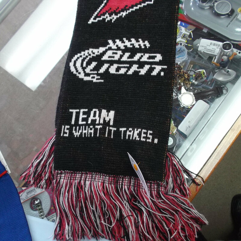 Arizona Cardinals Bud Light \"Team is what it takes.\" Scraf #8100
Rating:   (see below) 3 - Good Condition 
Team: Arizona Cardinals
Player: 
Brand: unknown
Size:  
Color: Black
Style: Scarf
Material: unknown
Condition: - Good Condition - wrinkled; Pilling and fuzz is present; Faded and discolored; Signs of use; No stains rips or holes(Please see the photos for condition and description) 
Shipping cost: $3.37
Item #: 8100