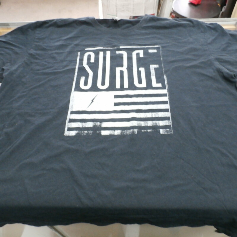 Surge Shirt, Black, Size: 2XL<br />
Men's Level black \"Surge\" shirt size 2XL cotton poly blend #28273<br />
Rating: (see below) 3- Good Condition<br />
Team: N/A<br />
Player: n/a<br />
Brand: Level<br />
Size: Men's XL- (Measured Flat: Across chest 24\"; Length 29\")<br />
Measured Flat: underarm to underarm; top of shoulder to bottom hem<br />
Color: Gray<br />
Style: Short sleeve; screen pressed; Graphic Tee;<br />
Material: 60% Cotton 40% Polyester<br />
Condition: 3- Good Condition: minor wear from use; wrinkled; pilling and fuzz;<br />
Item #: 28273<br />
Shipping: FREE