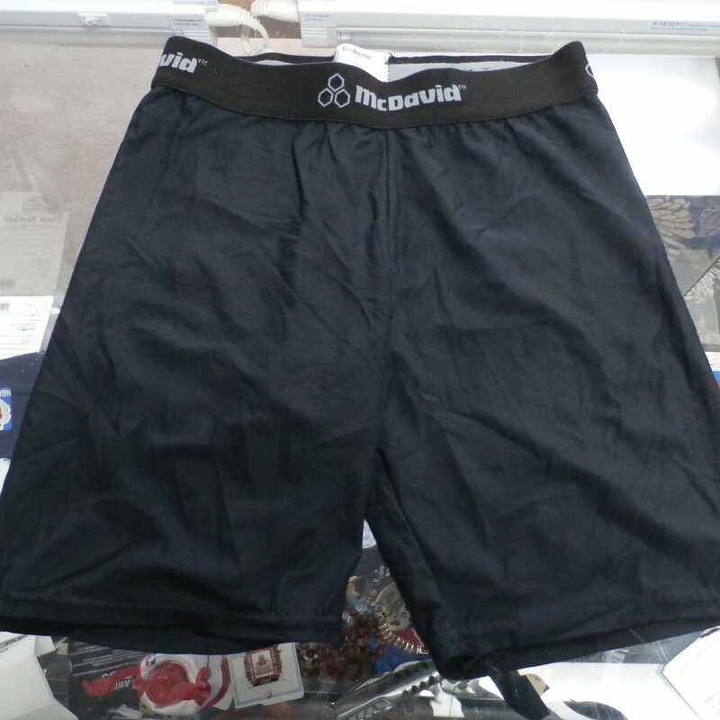 Men's McDavid Black Compression shorts size Medium nylon spandex blend #28275
Rating: (see below) 4- Fair Condition
Team: n/a
Players: n/a
Brand: McDavid
Size: Men's  medium (Measured Flat: waist 11\"; Length 14\"; inseam 5\")
Color: Black
Material: 85% Nylon 15% Spandex
Style: Compression shorts;
Condition: 4- Fair Condition: wrinkled; minor pilling and fuzz; some stretching at waist from wear; the stitching on the left leg of shorts is fraying bur doesn't  affect the integrity of them;
Item #28275
Shipping: FREE