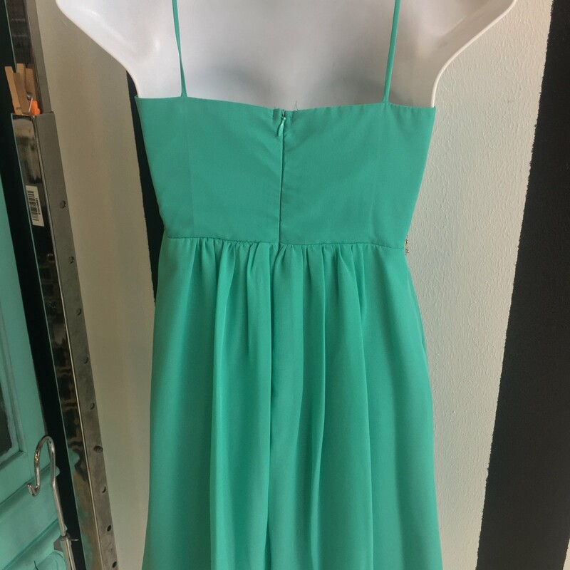 Cute, gently used, Sally USA brand short formal spaghetti strap dress. Teal in color, with silver rhinestones. Size small.