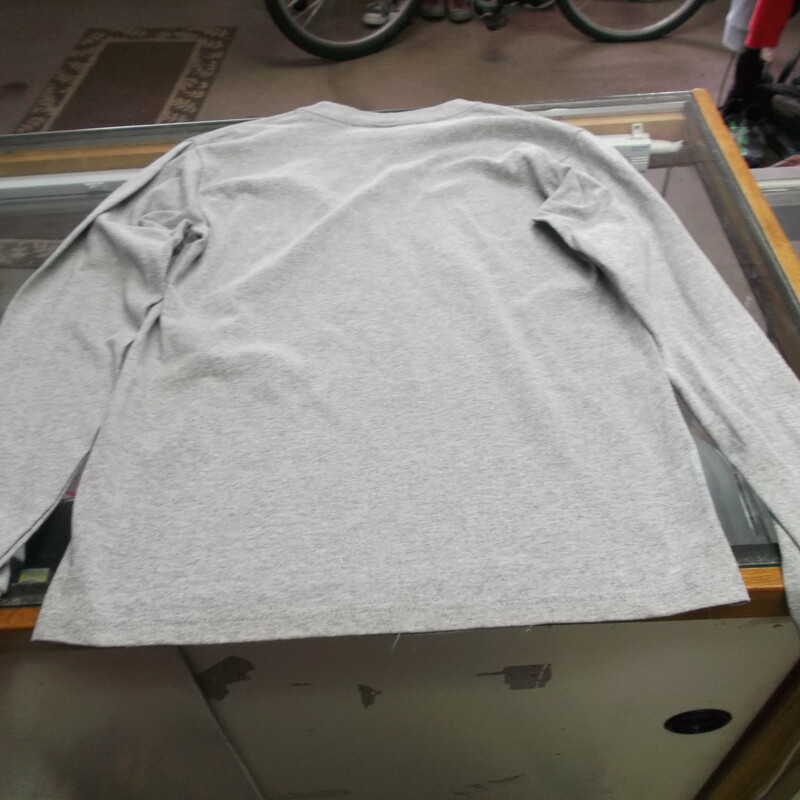 Montana Grizzlies YOUTH Anvil Long Sleeve Shirt Size Large Gray #8267<br />
Rating:   (see below) 3 - Good Condition<br />
Team: Montana Grizzlies<br />
Player: N/A<br />
Brand: Anvil<br />
Size: Large - YOUTH(Measured Flat: Across chest 17\"; length 25\") <br />
Color: Gray<br />
Style: Long sleeve screen pressed shirt<br />
Material: 90% Cotton 10% Polyester<br />
Condition: - Good Condition - wrinkled; Pilling and fuzz is present; Material feels coarse; Front part of the left side of the collar is stained; Definite signs of use; Logo looks great; No rips or holes(See Photos for condition and description)<br />
Shipping: $3.37<br />
Item #: 8267 