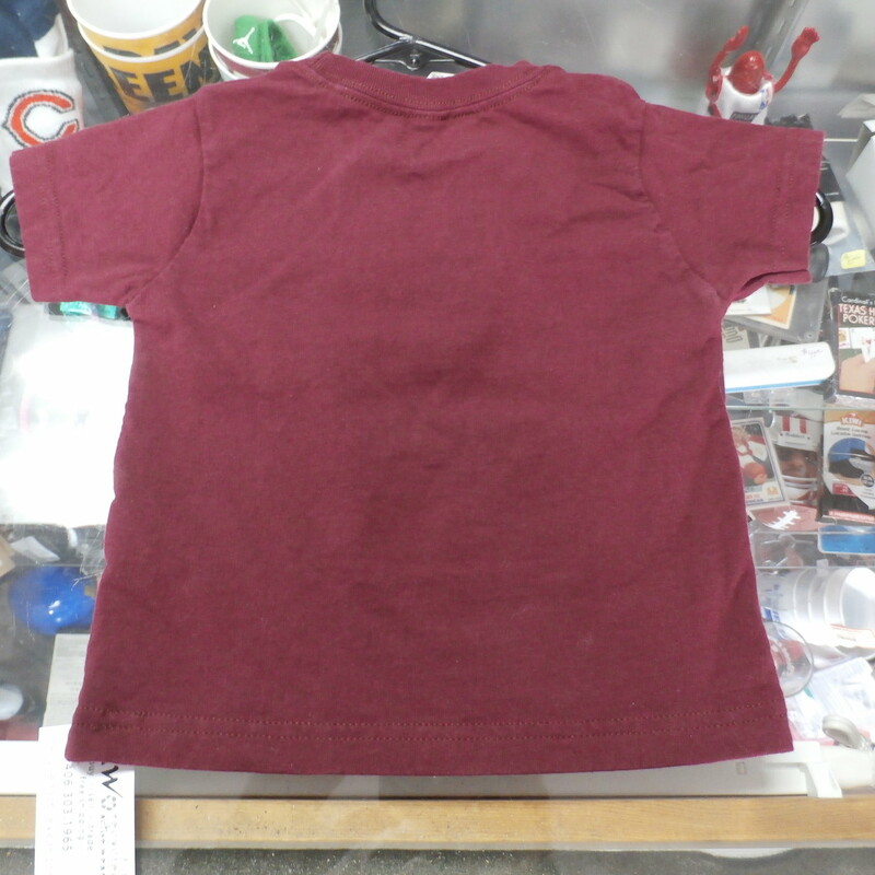 Montana Grizzlies #futuregriz YOUTH shirt maroon size 3 cotton #30177<br />
Rating: (see below) 3- Good Condition<br />
Team: Montana Grizzlies<br />
Player: n/a<br />
Brand: LAT Apparel<br />
Size: YOUTH 3- (Measured Flat: Across chest 12\"; Length 14\")<br />
Measured Flat: underarm to underarm; top of shoulder to bottom hem<br />
Color: maroon<br />
Style: short sleeve; screen printed<br />
Material: 100% cotton<br />
Condition: 3- Good Condition: minor wear from use; minor pilling and fuzz (see photos)<br />
Item #: 30177<br />
Shipping: FREE