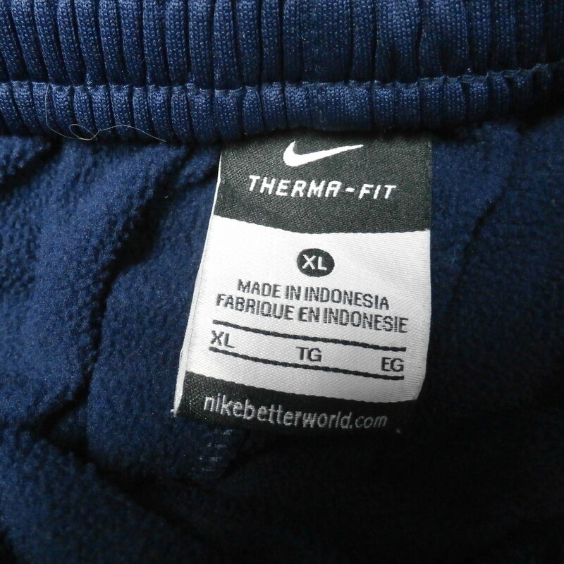 Men's Nike Villanova Tear away pants size XL blue 30385
Our Clothes Rating: 4- Fair Condition
Brand: Nike
size: Men's Large- (Waist 16\" Length: 42\"; inseam 28\")
color: Blue
Style: elastic waistband with drawstring; screen printed has pockets;
Condition: 4- Fair Condition - some wear and discoloration from use; wrinkled ; minor pilling and fuzz; light staining; the bottom button on the right leg is missing;
Shipping: FREE
Item #: 30385