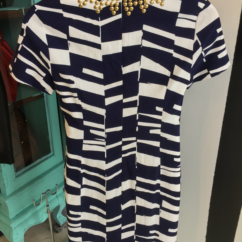 Chic Trina Turk dress. Brand new, size 10. Navy with white stripes and gold detail. With retail tags. Retail price: $398