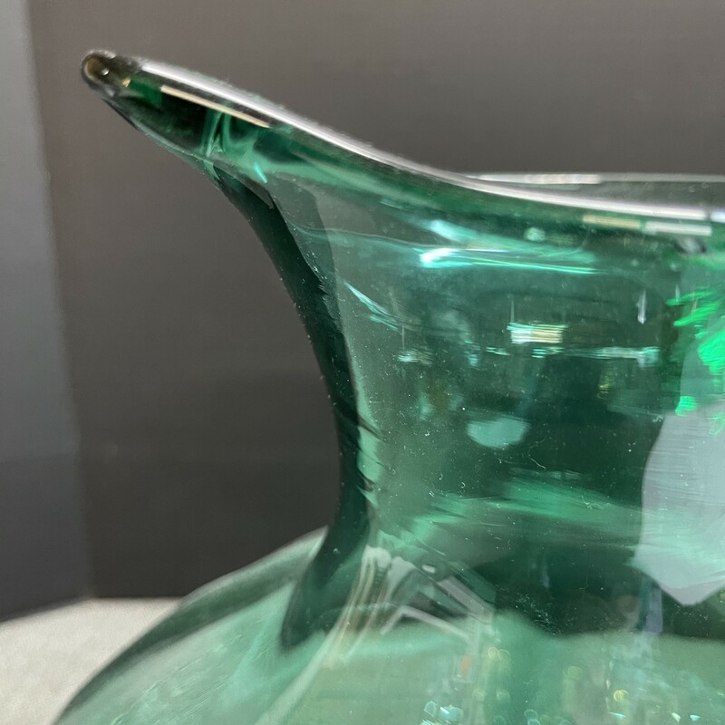 Blenko 14 inch tall pitcher. The fresh green color imparts energy and is a joy to look at! This beautiful vessel has no chips and is in excellent condition.