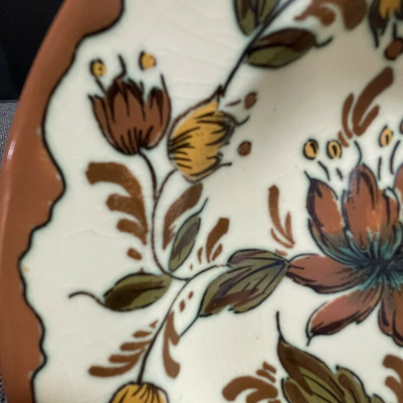 Gouda Dago plate. Gorgeous plate boasts dandelion; spice; orchid and sage hues. Plate measures almost 7 inches and is in beautiful;  ready for display condition! Signed and numbered! Circa 1950â€™s