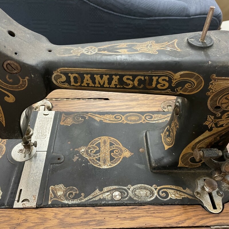 Antique Damascus sewing machine and table<br />
We are unsure of the age but the manual is in the drawer, see the photo!<br />
The table is in excellent condition!<br />
Size: 30H/36W/19D<br />
IN STORE PICK UP ONLY