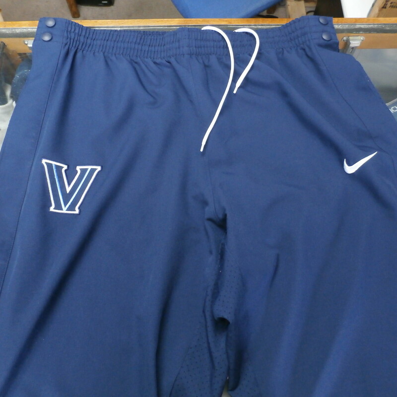 Villanova Wildcats blue Nike Elite Dri-Fit tearaway pants size XL #30387
Rating: (see below) 3- Good Condition
Team: Villanova Wildcats
Player: None
Brand: Nike
Size: Men's XLarge- (Measured Flat: Across waist 19\"; Length 43\" inseam 31\")
Color: blue
Style: elastic waistband with drawstring; embroidered
Material: 100% recycled polyester
Condition: 3- Good condition: minor wear and small snags from use; bottom button on right leg is missing (see photos)
Item #: 30387
Shipping: FREE