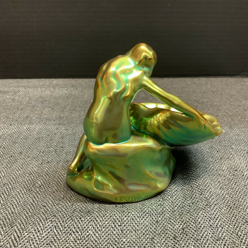 Roughly 5 inches wide by 5.5 inches tall; this piece shimmers beautifully in the light with hints of copper and aqua over its emerald surface.