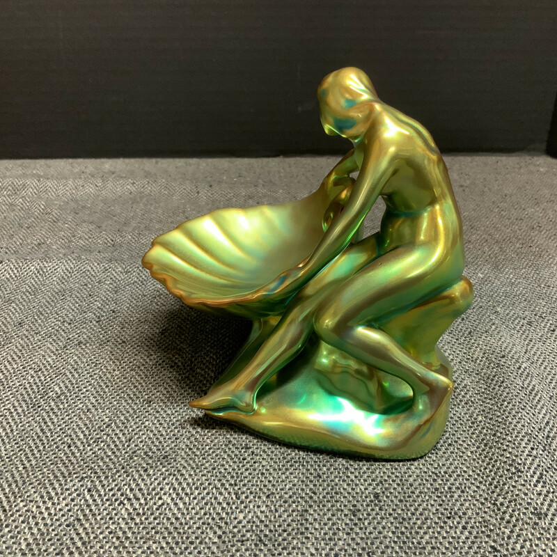 Roughly 5 inches wide by 5.5 inches tall; this piece shimmers beautifully in the light with hints of copper and aqua over its emerald surface.