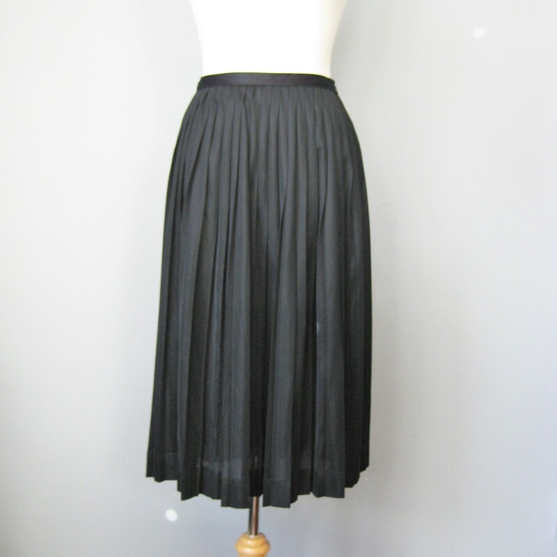 Super simple pleated skirt by Sacony<br />
I am calling it 60s because of the vinyl zipper and the look of the label but other garments that I've handled from this brand are all earlier<br />
It doesn't have any fabric labels but it feels like nylon<br />
It's got a defined waistband, zipper closure and it's pleated all the way around<br />
Very sheer, so you will need a sliip or bike shorts underneatch<br />
Excellent condition!<br />
The hem is turned up 2in so if you need to lengthen it you can get another 1.5in.<br />
Here are the flat measurements, please double where appropriate:<br />
Waist: 13.5in<br />
Hip: free<br />
Length: 27in<br />
<br />
Thanks for looking!<br />
#38020