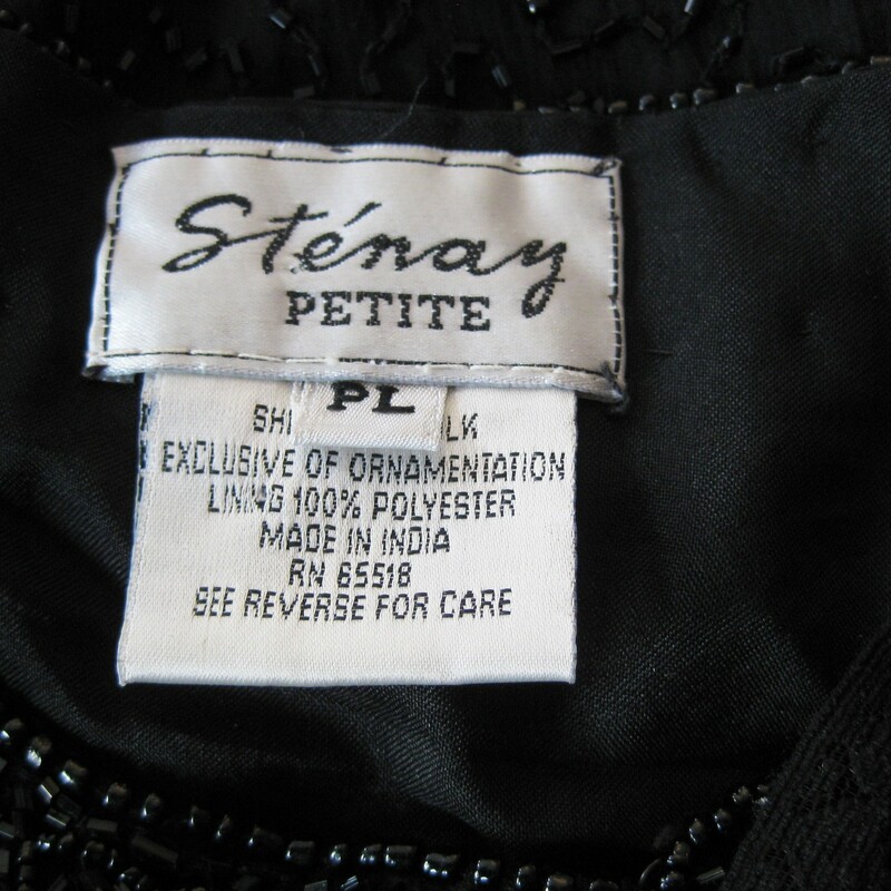 A handy piece to have in your evening arsenal. A beaded top from Stenay.
The shell is 100% silk and it is fully lined in polyester.
Totally covered with black beads
Hook n eye closures
Can be worn as a top or over a cami as a fancy sweater

All Black, excellent condition
Made in India
Moderate size Shoulder pads

Marked size Petite Large, better for a medium imho
Flat measurements:
Shoulder to shoulder: 17in
Armpit to armpit: 20in
Sleeve: 16.25in
Length: 20in
Width at hem: 21in

Thank you for looking.
#36002