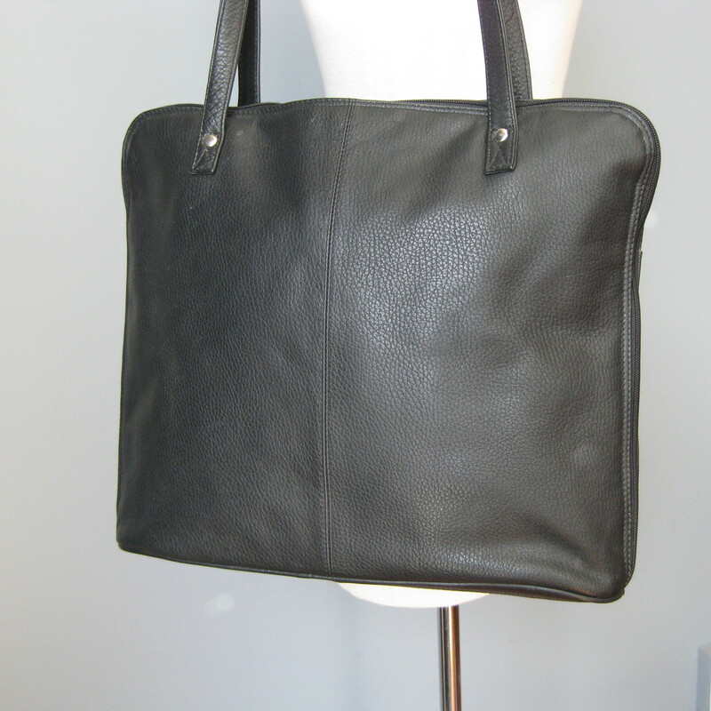 Sleek black leather work tote from Latico.
Slim profile with silver metal zippers that allow the bag to expand as needed.
Double straps
Zipper closure at the top
Card slots, pen holders and middle zipper pocket inside
large outside slip pocket
Made in India
Excellent condition with a touch of wear at one side near the bottom as shown.

16in x 12.75in x 3.5in

thanks for looking!
#39225
