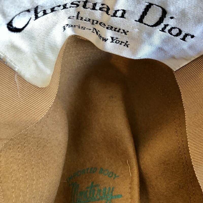 Fabulous vintage CHRISTIAN DIOR Felt Wool hat with leather band c. 1950, It's a pretty neutral camel color. Inside diameter is 7.25in front to back and 6.5in side to side. Brim to brim is 14in.<br />
Will ship USPS Priority mail.