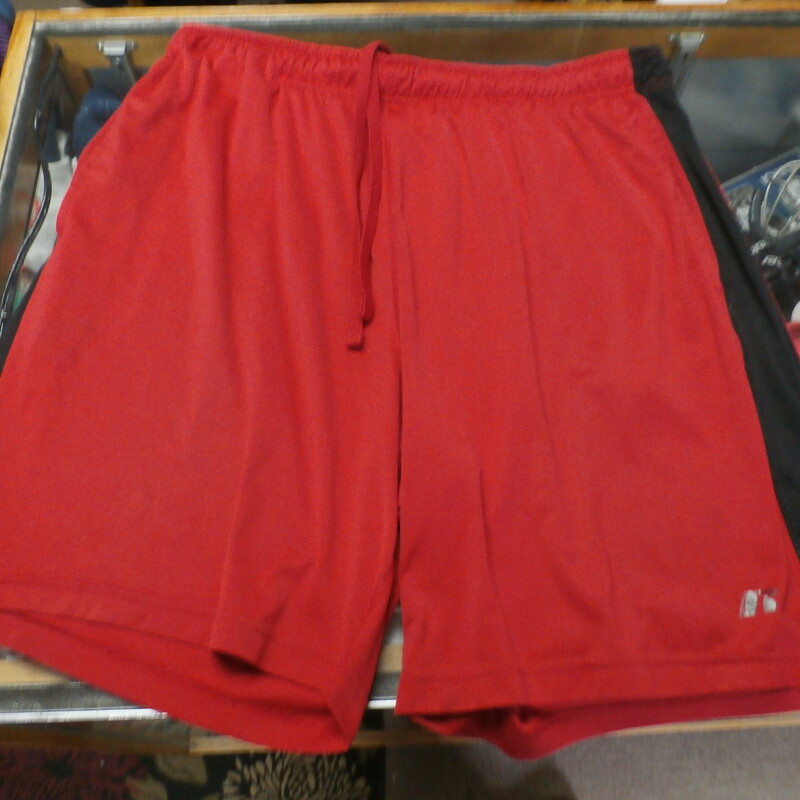 Russell red athletic shorts size Large 100% polyester #29133<br />
Rating: (see below) 4- Fair Condition<br />
Team: n/a<br />
Player: n/a<br />
Brand: Russell<br />
Size: Men's Large- (Measured Flat: Across waist 18\"; Length 20\" inseam 8\")<br />
Color: red<br />
Style: elastic waistband with drawstring; pockets<br />
Material: 100% polyester<br />
Condition: 4- Fair Condition: loose threads on waistband; numerous stains; minor wear (see photos)<br />
Item #: 29133<br />
Shipping:FREE