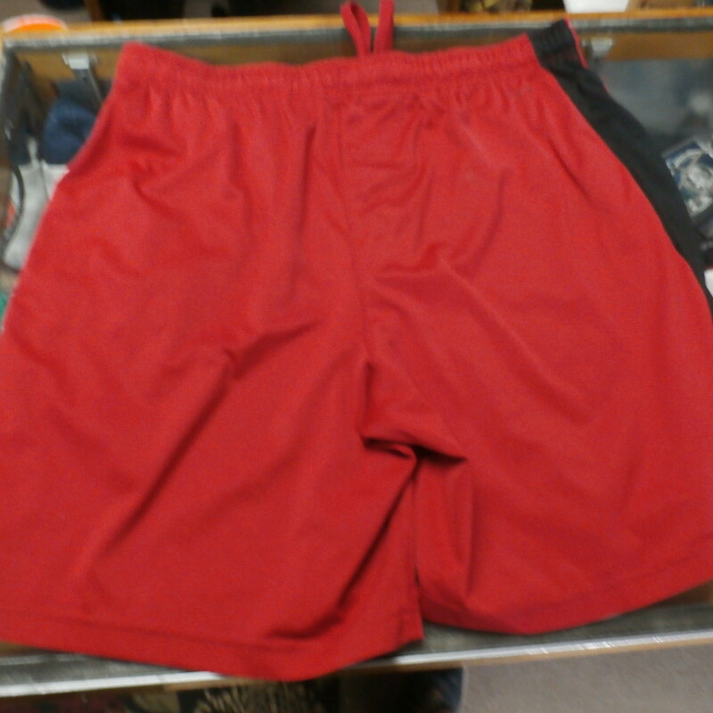 Russell red athletic shorts size Large 100% polyester #29133<br />
Rating: (see below) 4- Fair Condition<br />
Team: n/a<br />
Player: n/a<br />
Brand: Russell<br />
Size: Men's Large- (Measured Flat: Across waist 18\"; Length 20\" inseam 8\")<br />
Color: red<br />
Style: elastic waistband with drawstring; pockets<br />
Material: 100% polyester<br />
Condition: 4- Fair Condition: loose threads on waistband; numerous stains; minor wear (see photos)<br />
Item #: 29133<br />
Shipping:FREE