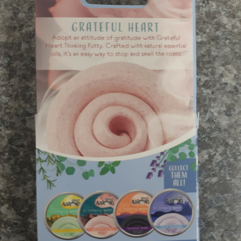 Adopt an attitude of gratitude with Grateful Heart Thinking Putty. Crafted with natural essential oils, it’s an easy way to stop and smell the roses.<br />
<br />
<br />
• Collection: SCENTsory™ | Color: Pink with red specks | Scent: Rose | Texture: Extra Soft<br />
• Made in the USA from nontoxic silicone and never dries out<br />
• Stretch it, bounce it, pop it, tear it, and sculpt it! Fun for ages 3+<br />
• Includes 20 grams of Genuine Crazy Aaron’s Thinking Putty<br />
• Thinking Putty is manufactured with the help of exceptional individuals challenged with disabilities
