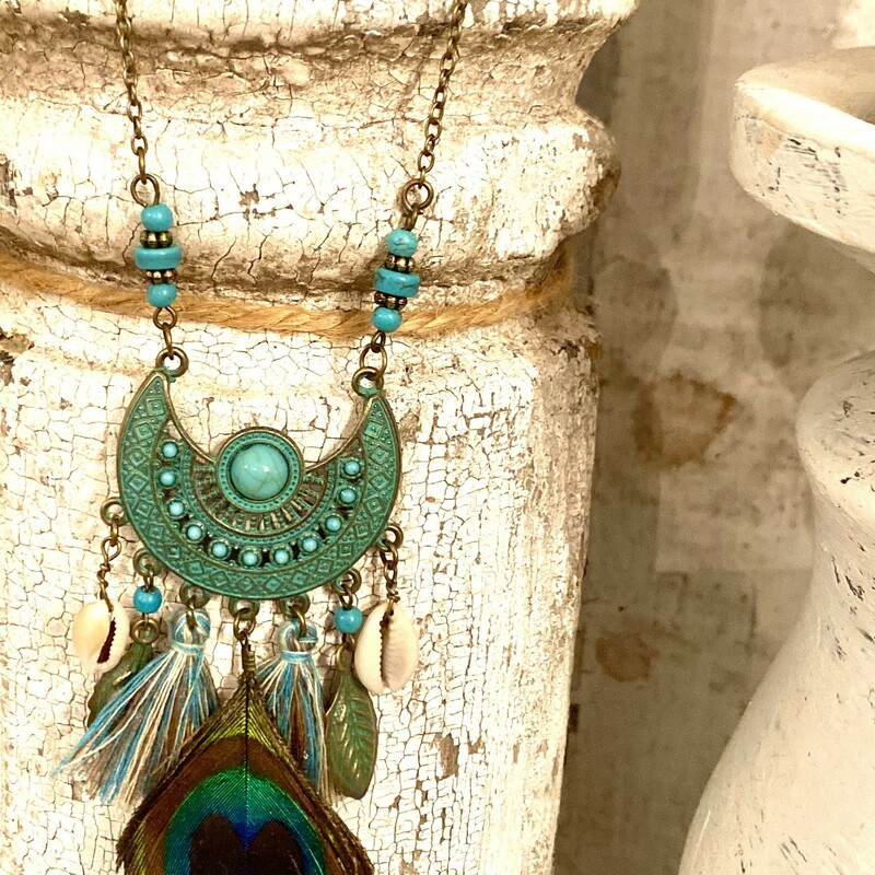 This is the perfect boho necklace to make any outfit a little more edgy. The turquoise colors; mix of tribal beads and tassels are a perfect combination.