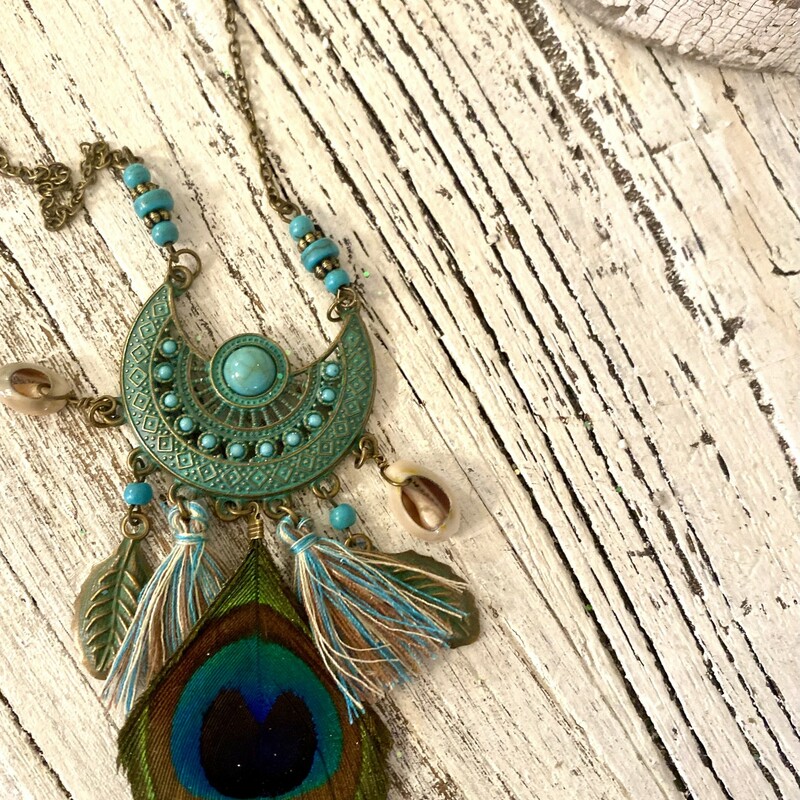 This is the perfect boho necklace to make any outfit a little more edgy. The turquoise colors; mix of tribal beads and tassels are a perfect combination.