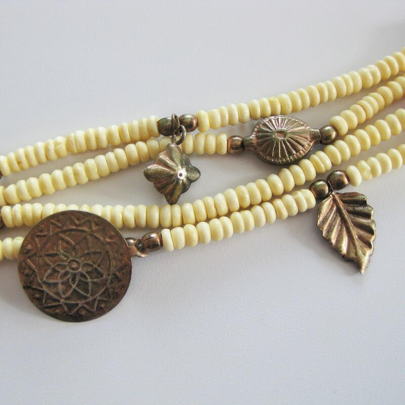 Wood And Brass, Ivory, Size: None<br />
Tribal style necklace made from multiple strands of ivory and orange beads, metal coins and charms<br />
<br />
Wear as shown or twist it into a choker length torsade.\\<br />
<br />
<br />
28.75in long<br />
closes with a silver toned hook<br />
<br />
thanks for looking!<br />
#40106