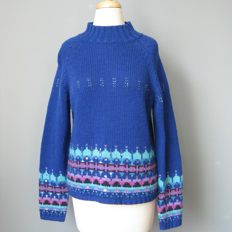 Acrylic and lambswool blend ski sweater by St. John's Bay from the 1980s
So cute in royal blue with touches of lavender and a sprinkling of bugle beads
small section of missing beads as shown
Marked size medium petite
flat measurements:
armpit to armpit: 18.75in
length: 20in

made in Hong Kong

thanks for looking!
#39252