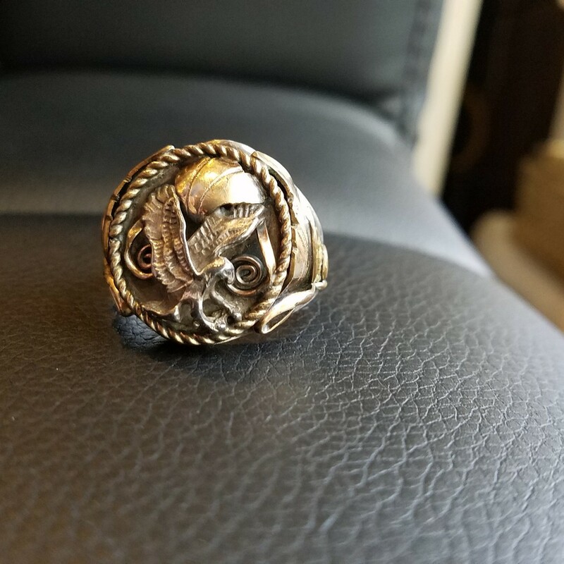 This is a vintage Navajo S. Ray sterling silver eagle ring. The ring features a gold filled overlay. The ring is size 12
RARE FIND