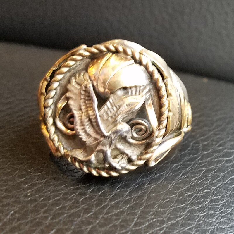 This is a vintage Navajo S. Ray sterling silver eagle ring. The ring features a gold filled overlay. The ring is size 12
RARE FIND