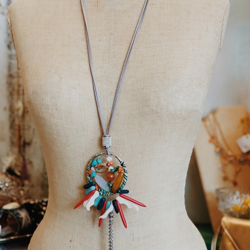 The pendant on this necklace is magnificent! Avalible in nuetral brown tones or red and blue!