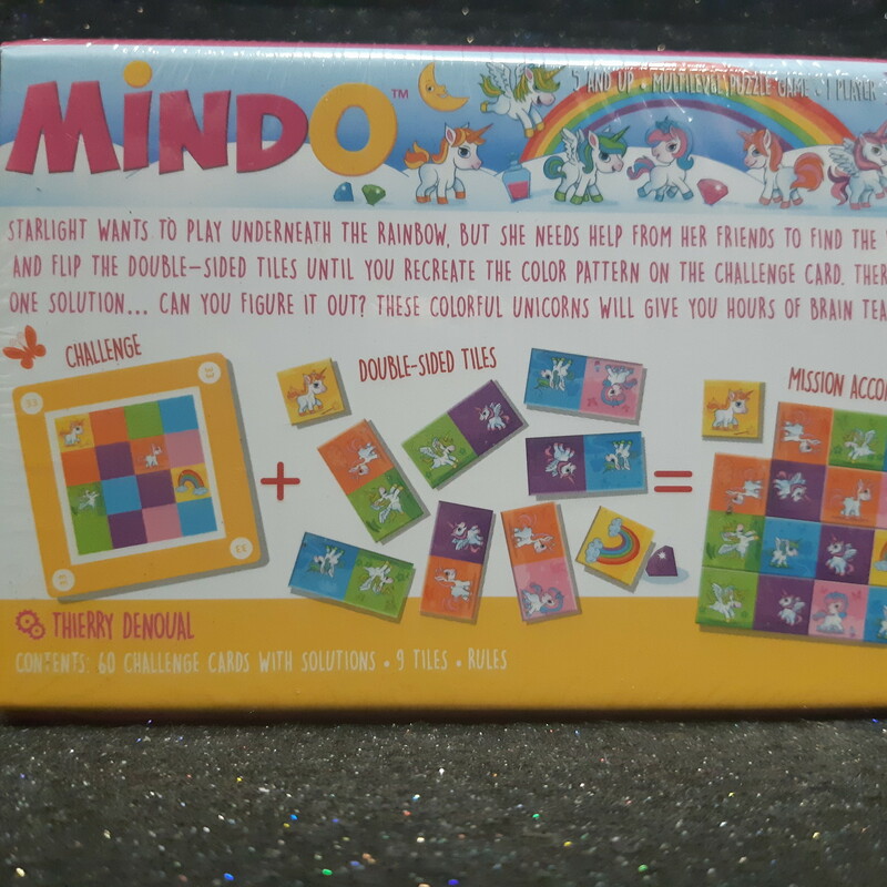 Mindo Unicorn is one of 4 clever puzzles in the Mindo Collection. Can you collect and master them all? Each puzzle can be played solo or be combined with the others to play with friends! No matter the iteration the rules are the same: turn and flip the double-sided tiles until you have recreated the color pattern on the challenge card. But be attentive! The tiles only fit one way into a 3×3 or 4×4 grid. With 60 unique challenge cards and 4 degrees of difficulty, this enchanting game promises hours of brain teasing fun!<br />
<br />
In this magical version, Starlight and her fellow unicorns inspire young children to nourish their logic skills so they can solve the challenges on their own.
