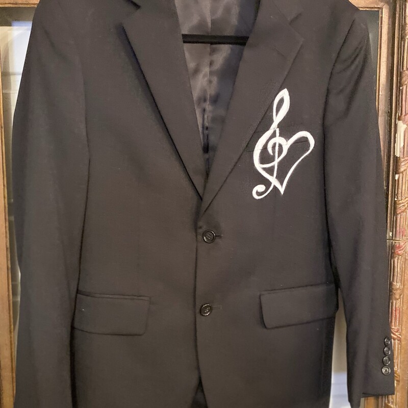 This is a super cool 100% wool lined menâ€™s suit coat with a hand painted boho guitar. This unique piece will be adorable with cowboy boots and jeans or over a cute dress.