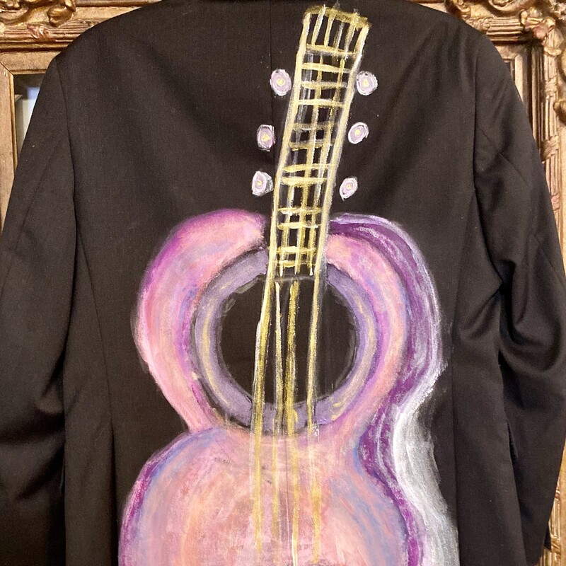 This is a super cool 100% wool lined menâ€™s suit coat with a hand painted boho guitar. This unique piece will be adorable with cowboy boots and jeans or over a cute dress.