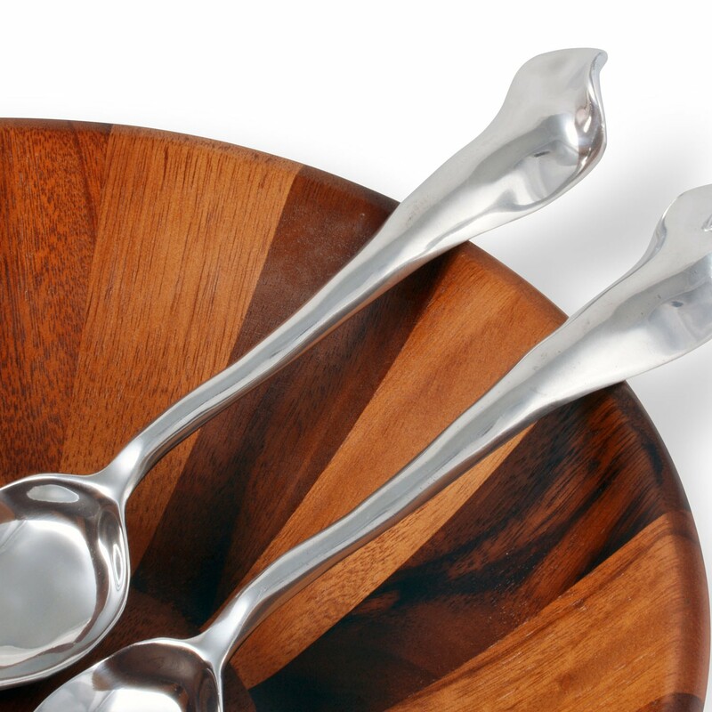 Salad Servers Caramel

Theseuniquely designed spoon and fork set enhances the appearance of any serving piece in your dining table setting. The salad servers are handcrafted from premium signature aluminum alloy for long-lasting wear and made in compliance with FDA food-safety regulations. Clean these utensils by hand with a mild soap and hand-dry to avoid water spots from forming.

11 inches
