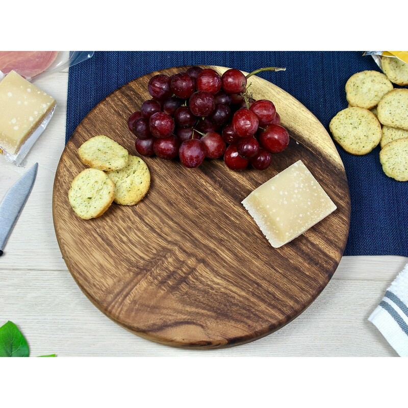 Walnut Round Board, 15 inch

Round Charcuterie or Cutting boards are all made from one solid piece of wood. Hand-crafted round board are perfect for serving charcuterie, appetizers, and highlighting entrees. Each board is unique, as we allow the organic nature of the tree's grain to craft each board. This boards is durable, and coated with a food safe blend of organic beeswax and mineral oil. Also available customized with engraving of logos, names, or even hand written recipes.