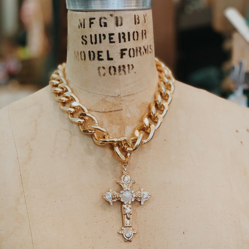 This piece is such a statement with the chunky gold chain and the large cross pendant! This one will definitely turn heads!