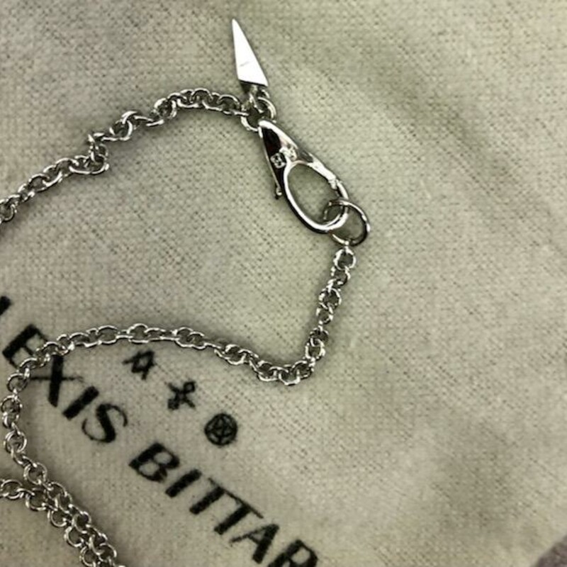 ALEXIS BITTAR<br />
Crumpled Rhodium Pendant Necklace<br />
Rhodium tone plated brass<br />
32\" length, 3\" pendant length<br />
Original Retail Price:  $155<br />
Comes with Original bag<br />
This necklace is in like new condition<br />
NOTE:  This necklace is currently available on-line at Alexis Bittar for $155.00