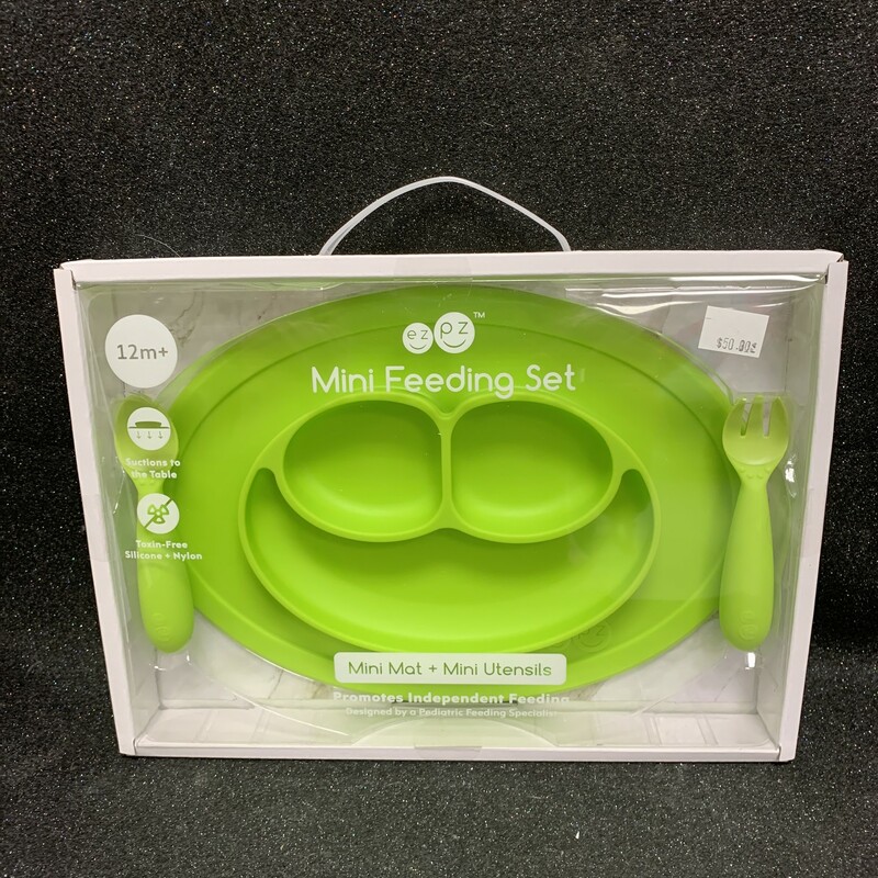 Mini Feeding Set Green, 12m+, Size: Eating

The Mini Mat is ezpz's top-selling product, and it is a great mealtime solution for both infants and travel. The Mini Mat is an all-in-one placemat + plate that suctions to the table. The mat’s stable base reduces tipped bowls / plates and helps infants and toddlers learn to self-feed.

Suction feature decreases tipped bowls and plates
Stable base promotes self-feeding and develops fine motor skills
Smile design encourages a positive mealtime experience
Mat fits most highchair trays
Three compartments remind parents to serve a well-balanced meal
Compact and lightweight for dinners out and travel
Packaged in a reusable bag that is ezpz to pop in your diaper bag