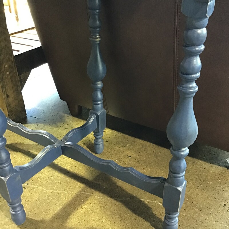 This beautiful accent table was done by a local artist. The legs are painted a dark blue/gray color mixture of Midnight Sky and Liquorice with a gold mouse. The top is finished with polyurethane and a walnut stain. The wood has gorgeous detailing in the legs. This piece is a unique accent table perfect to place in any room.

Dimensions: 33 in x 19.5 in x 29 in