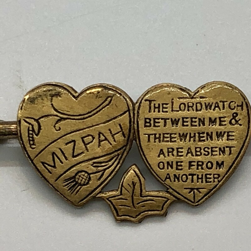 Mizpah Brooch in Brass c.1890-1915.
The Lord watch between me and thee when we are absent from each other.
Mizpahbrooches are given as symbols of protection and togetherness.  The word itself means 'watchtower' in Hebrew and this traditiion was particually popular in English Victorian jewelry.