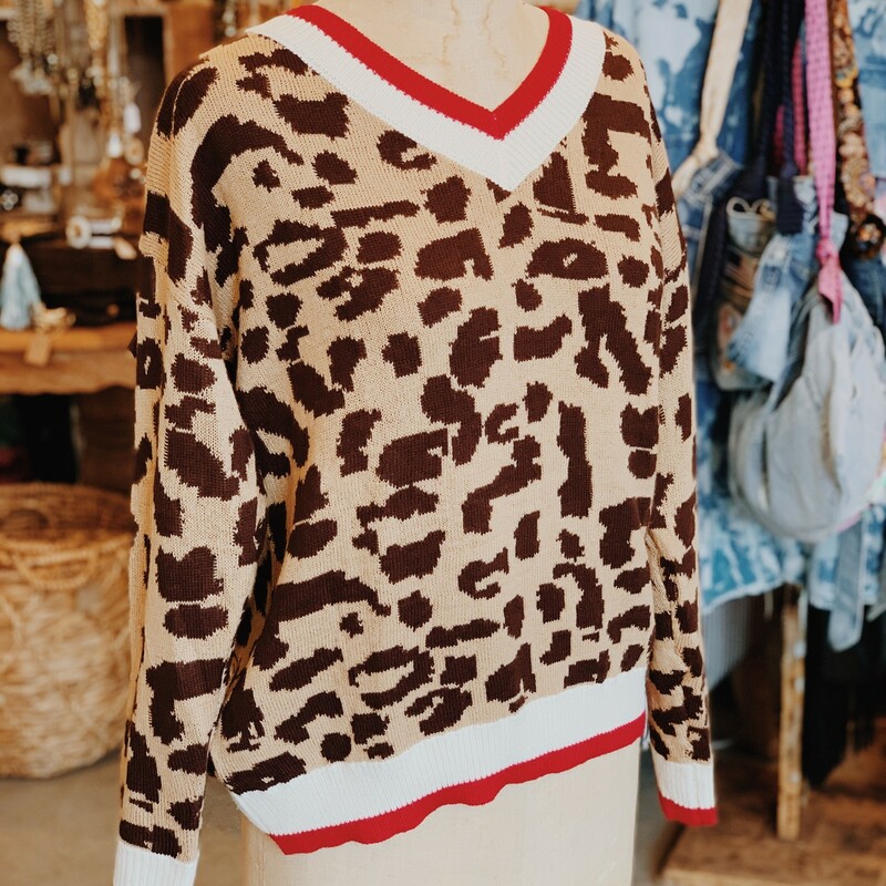 How adorable is this cheetah print sweate with bright red and cream bordering? Snatch yours up today!