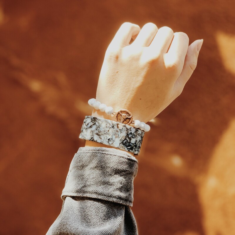 The white marbled beads on this bracelet look so great with the copper bull! Snag yours today!