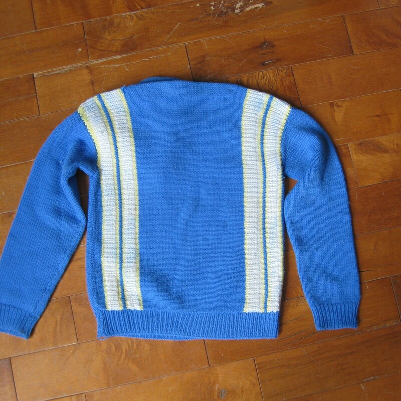 THis is a little boys' sweater and cap set from the 1960s.<br />
It belonged to a friend of mine and was given to me by his mother as she is doing some clearing out.<br />
Very sweet blue color with white and yellow stripes<br />
<br />
No labels, feels like wool acrylic blend<br />
<br />
I couldn't find any modern boys sizing charts to help give this a size... they all want to know how tall your boy is and what age...<br />
This will fit a child who measures 24in around at the chest<br />
The sweater is 17.5in in length<br />
Excellent condition with a tiny smidge of paint at the end of the right sleeve.<br />
<br />
thanks for looking!<br />
#16078